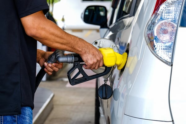 a malaysian man fuels his car tank with ron95