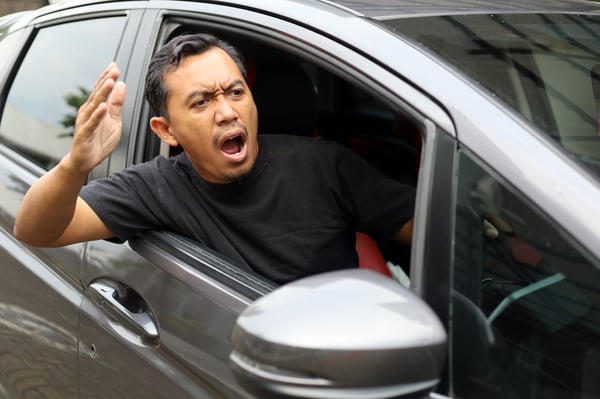 an angry driver shouting at other drivers